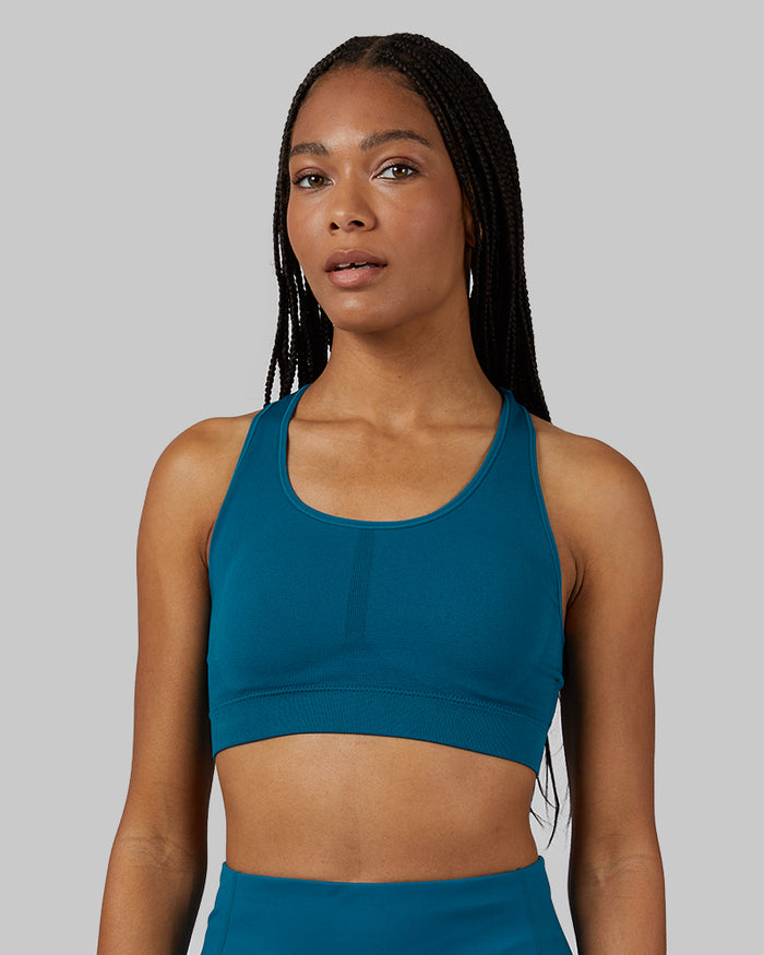 32 Degrees Moroccan Blue _ Women's Seamless Racerback Sports Bra {model: Dido is 5'9"and size 4, wearing size S}{bottom}{right} {bottom}{right}